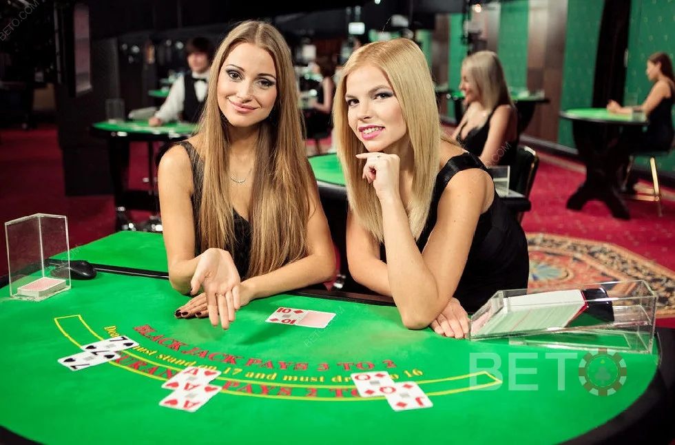 Tampilan ruang live casino pada perangkat dengan meja dan dealer